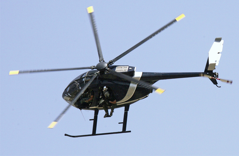 Illustration for article titled Watch This Night Stalker MH-6 Little Bird Land On A Tiny Concrete Barrier